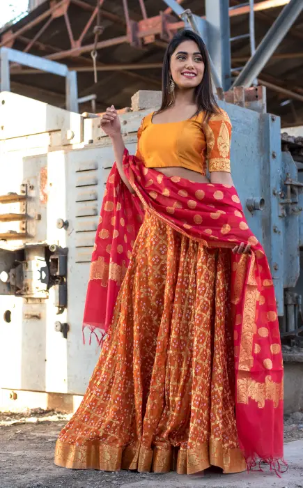 Orange lehenga set with red dupatta